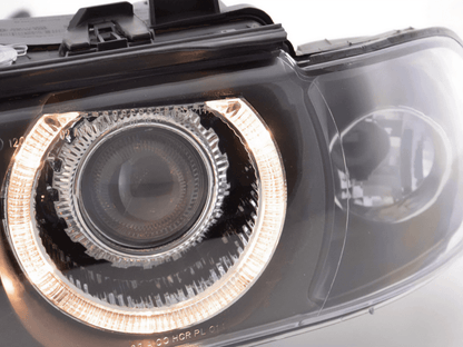 BMW E39 5-Series Xenon Angel Eye Rings Headlights by K2 Industries showing the illuminated angel eye rings on the front of the car.