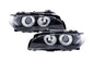 Black OE+ Angel Eyes headlights for BMW E46 3-Series Coupe (2002-2005) by K2 Industries, showing the sleek headlight design.
