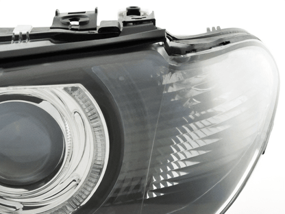BMW E46 3-Series Coupe black OE+ Angel Eyes headlights by K2 Industries, for 2002-2005 model with clear lens and LED accents.