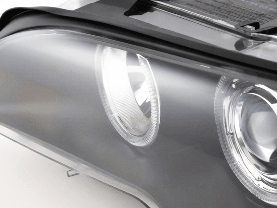 BMW E46 3-Series Coupe black OE+ Angel Eyes headlights by K2 Industries, showing the headlights with black housing and angel eye rings.