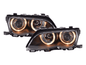 Black BMW E46 3-Series sedan OE+ Angel Eyes headlights by K2 Industries, 2003-2006 model, showing front view with illuminated rings