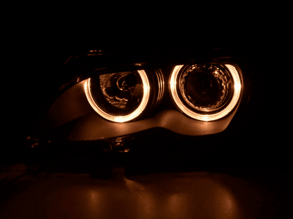 BMW E46 3-Series Sedan black OE+ Angel Eyes headlights, 2003-2006, by K2 Industries, showing close-up of headlights with angel eyes.