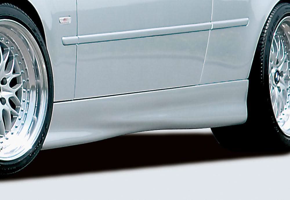 BMW E46 coupe or convertible with K2 Industries Rieger Twisty side skirts installed, showcasing sleek automotive styling.
