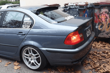 Black BMW E46 Sedan Series 3 roof wing spoiler by K2 Industries, designed for model years 1998 to 2006, mounted on the car roof.