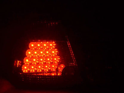 BMW E46 Sedan smoked Altezza style LED tail lights for pre-facelift models, made by K2 Industries, showing close-up of the taillight assembly.