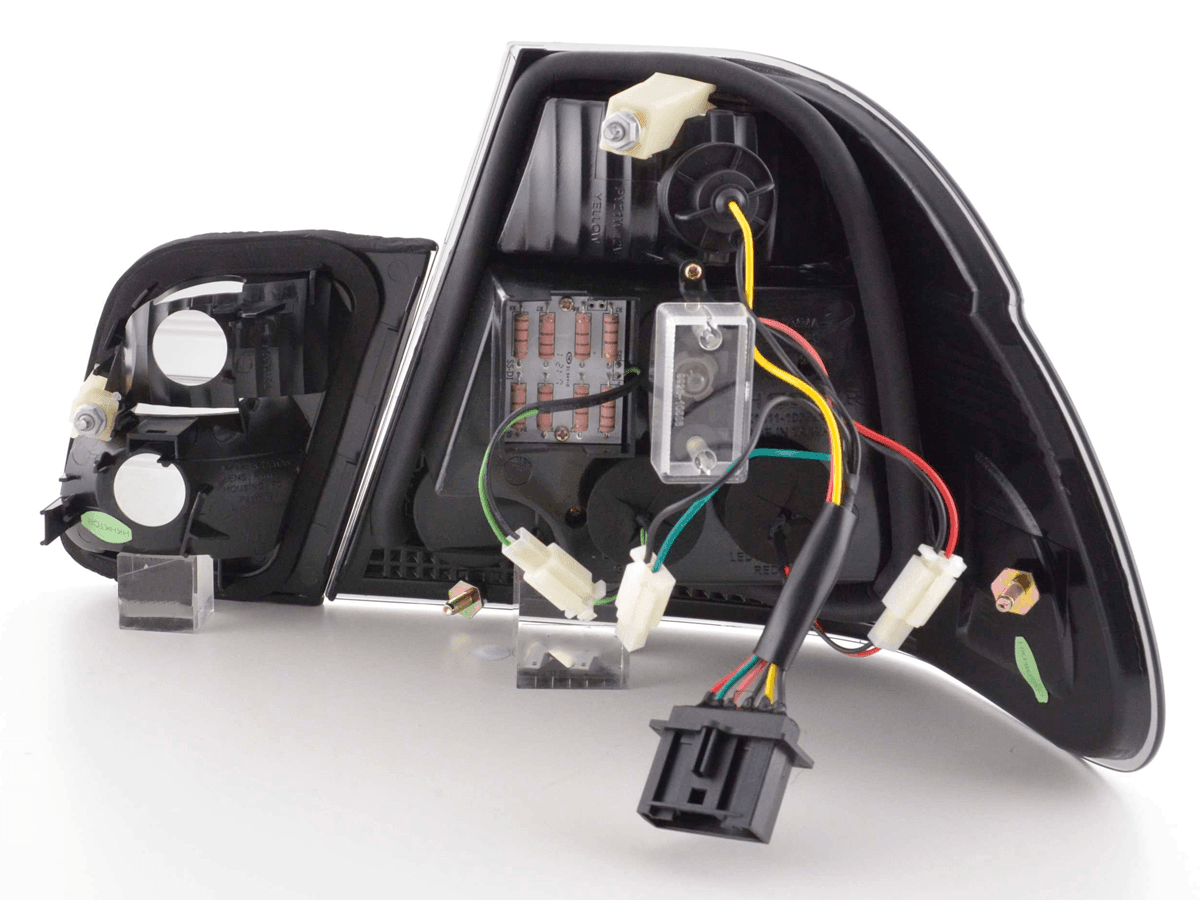 BMW E46 Sedan smoked Altezza style LED taillights for pre-facelift models, featuring dark tinted lenses and sleek design.