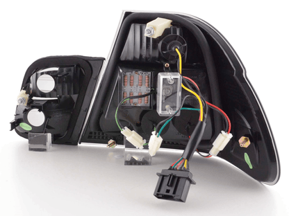 BMW E46 Sedan smoked Altezza style LED taillights for pre-facelift models, featuring dark tinted lenses and sleek design.