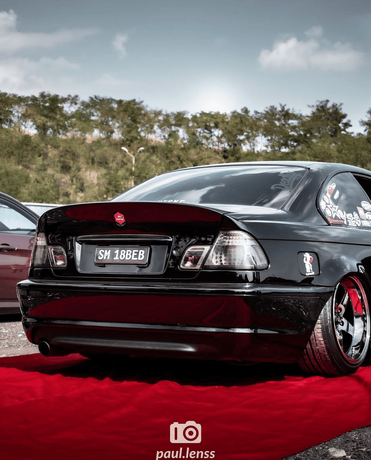 BMW E46 coupe clear smoked LED tail lights by K2 Industries, showing sleek design and LED illumination on the vehicle.