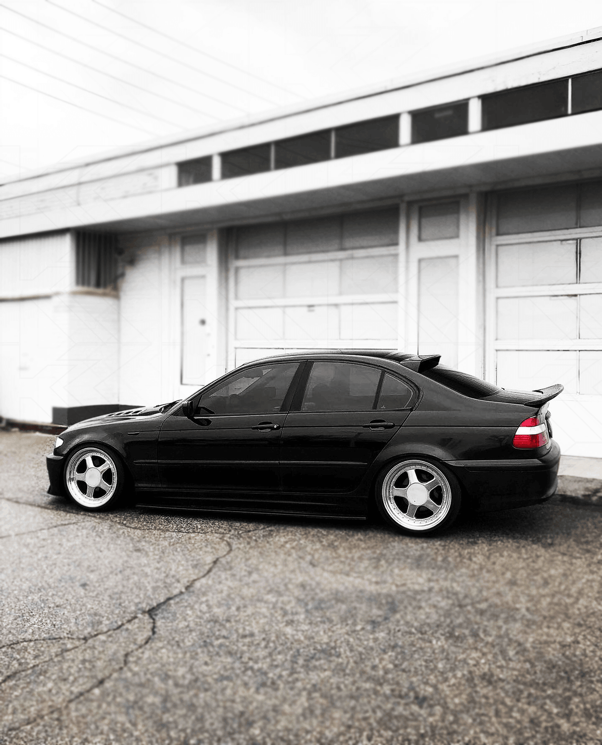 BMW E46 Series 3 drag wing style trunk spoiler by K2 Industries, shown on the car's rear trunk lid, enhancing sporty look.