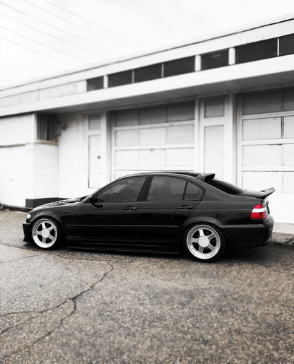 BMW E46 Series 3 drag wing style trunk spoiler by K2 Industries, shown on the car's rear trunk lid, enhancing sporty look.