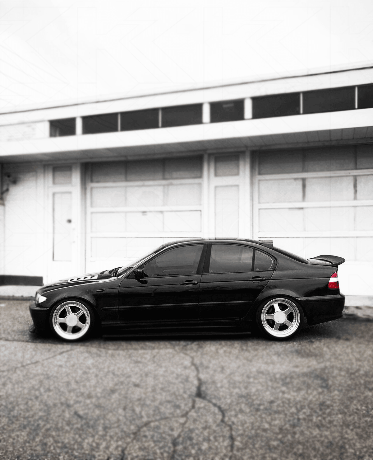 BMW E46 Series 3 drag wing trunk spoiler by K2 Industries, showing the sleek aerodynamic design on the car's rear.