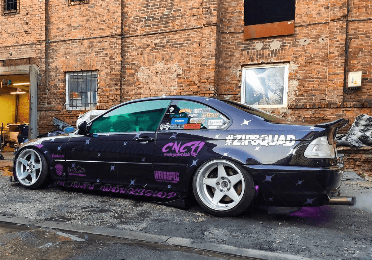 BMW E46 Series 3 drag wing style trunk spoiler by K2 Industries, shown on the car's rear hatch for model years 1995 to 2005.