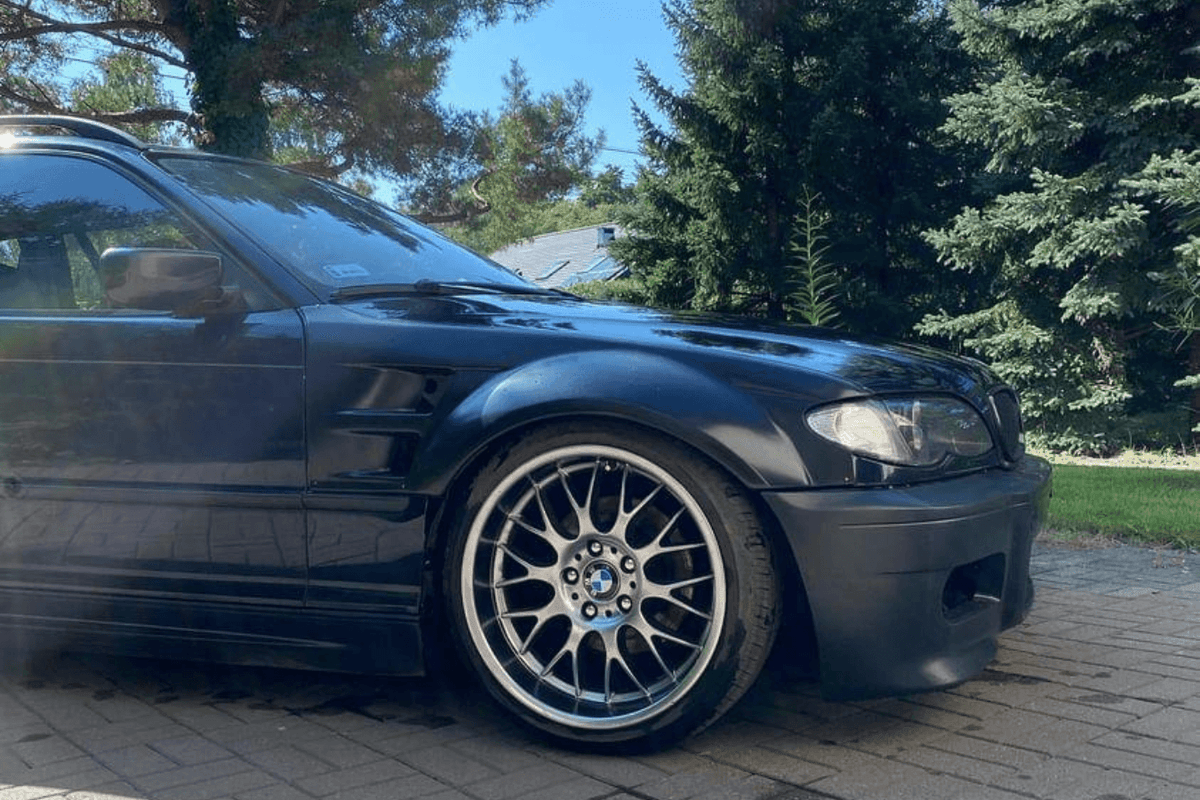BMW E46 Touring Series 3 wide body kit by K2 Industries, featuring custom bumpers, side skirts, and wide fender flares for model years 1997-2005.
