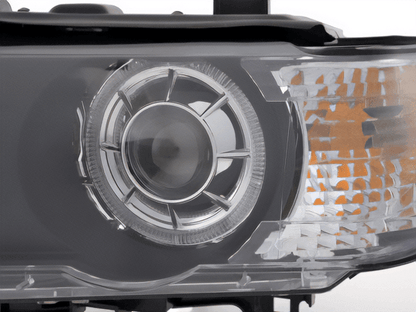BMW E53 X5 black OE+ angel eye headlights by K2 Industries, for 2000-2003 models, showing front view with clear lenses and black housing.