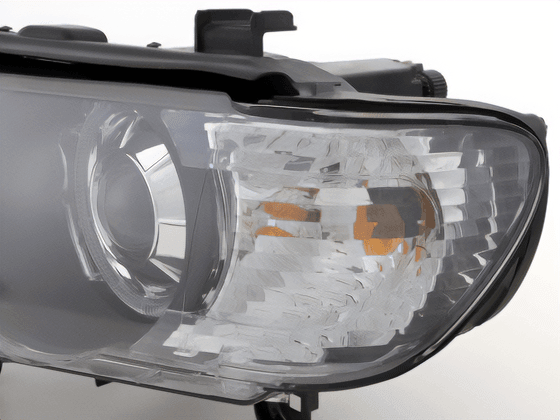 BMW E53 X5 black OE+ angel eye headlights by K2 Industries for 2000-2003 model, showcasing sleek headlight design with angel eyes.