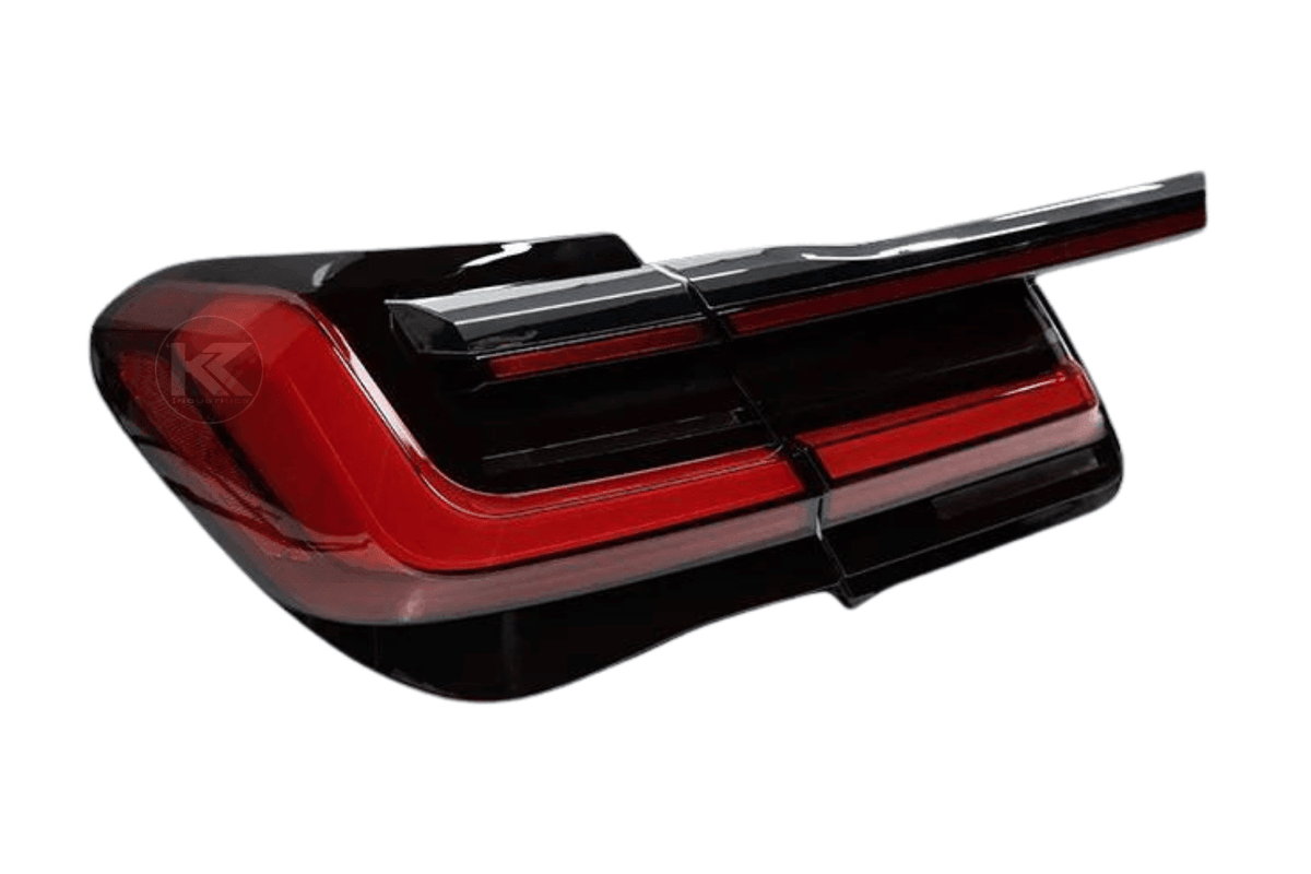 BMW F02 7 Series red LED tail lights by K2 Industries, luxury beam style, installed on a 2008-2015 vehicle, showing illuminated lights.
