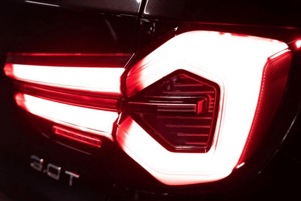 BMW F25 X3 2010-2017 LCI style LED tail lights by K2 Industries, close-up view of sleek, modern automotive taillights.