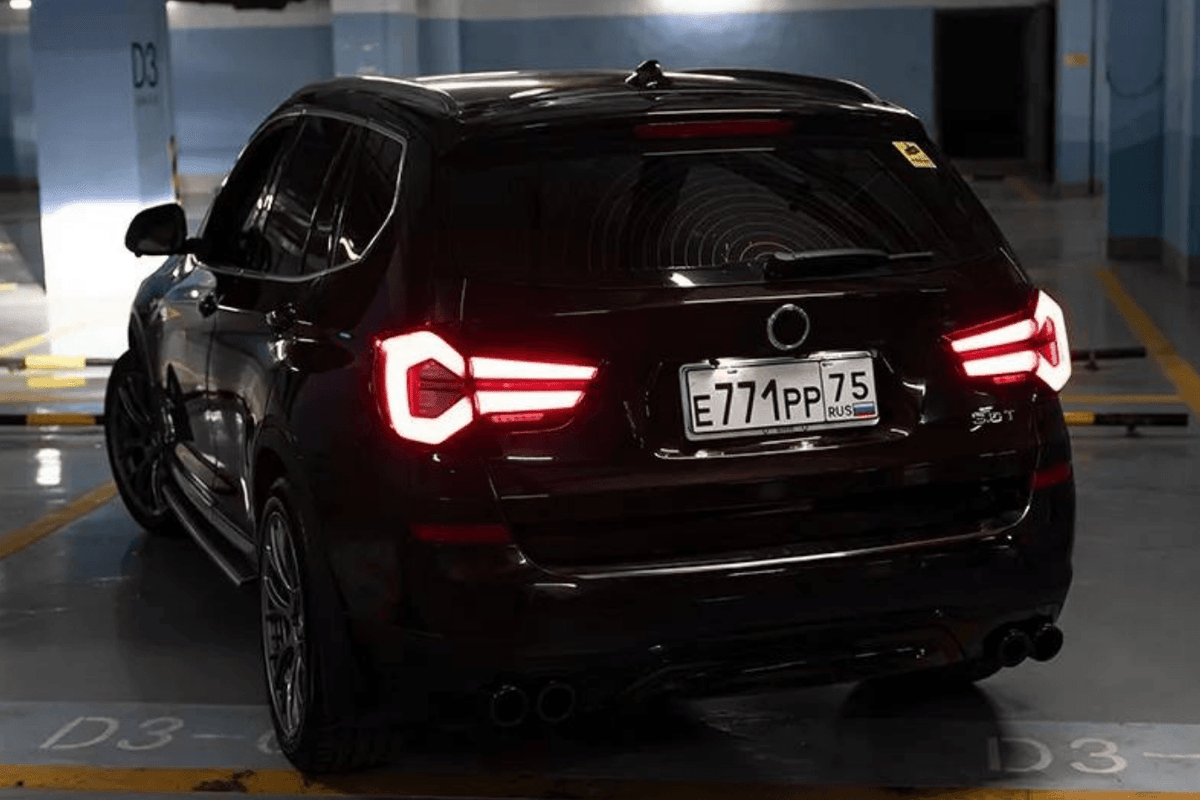 BMW F25 X3 LED tail lights by K2 Industries, next gen LCI style, showing sleek design and bright illumination for 2010-2017 models.