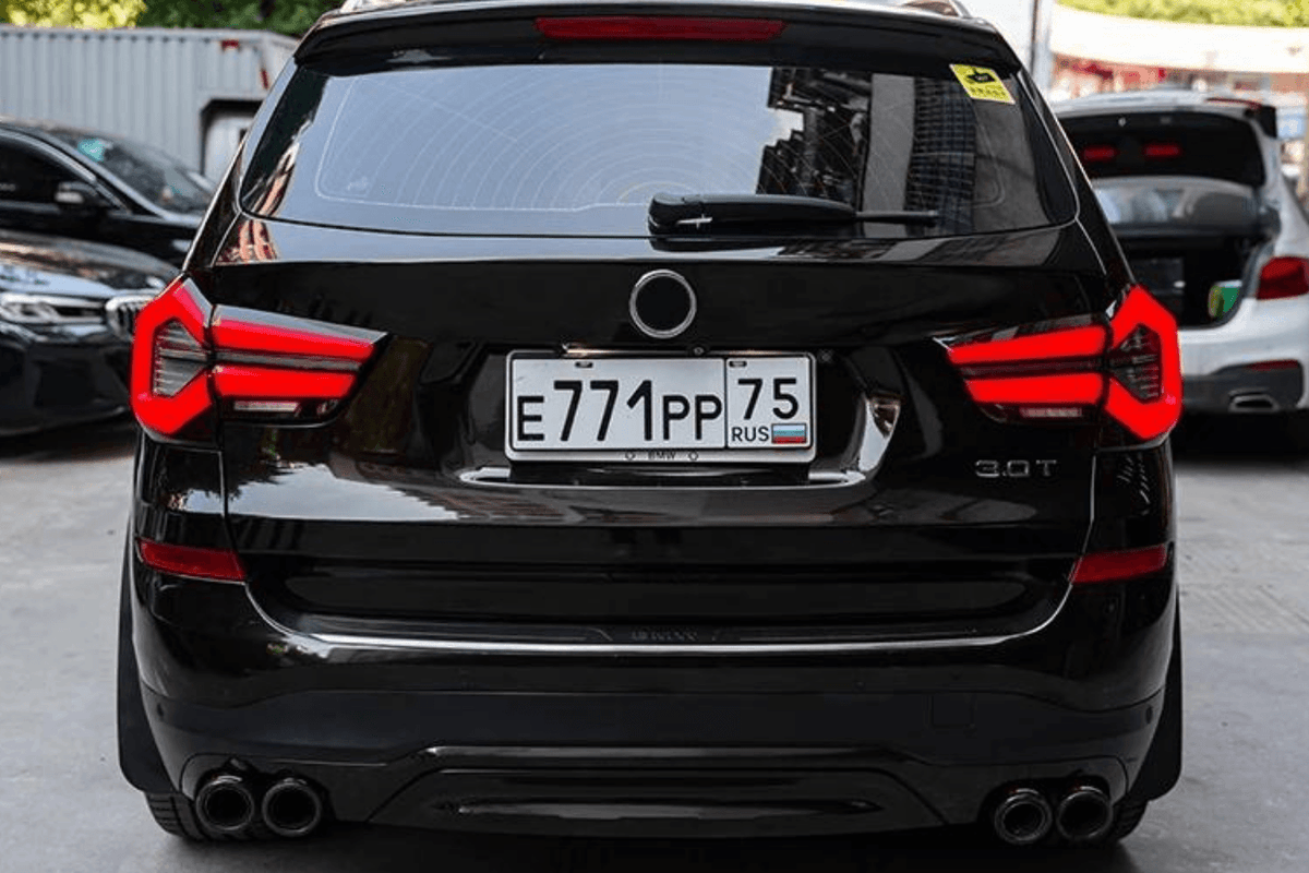 BMW F25 X3 LED tail lights by K2 Industries, next-gen LCI style, showing sleek red and clear lens design on a 2010-2017 model.