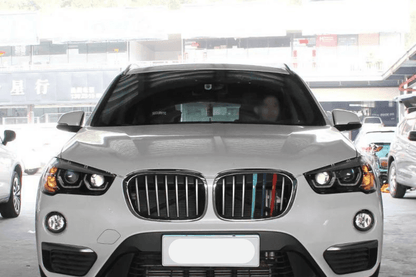 BMW F48 X1 modern style headlights upgrade by K2 Industries, showing sleek headlight assembly with LED daytime running lights.
