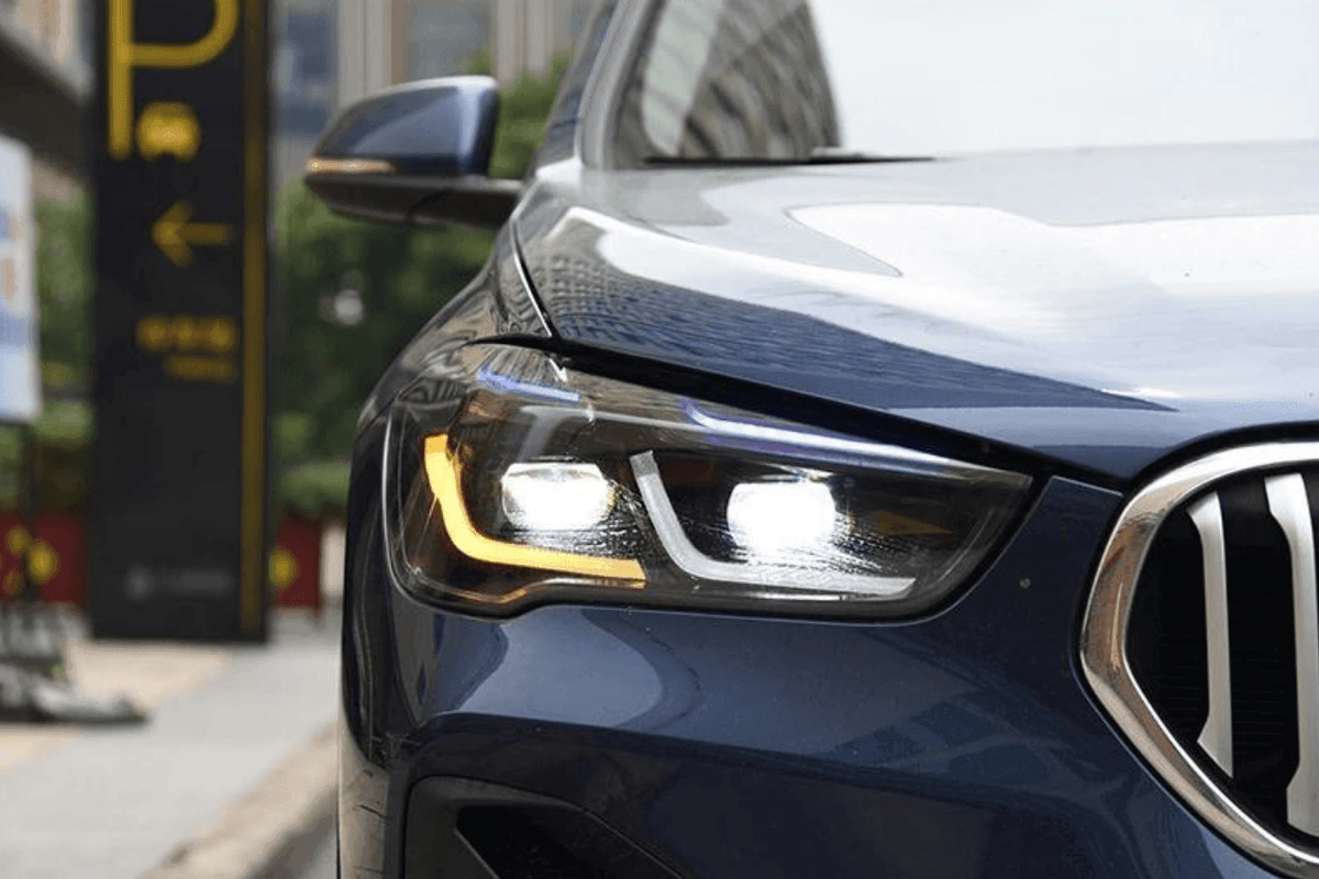 BMW F48 X1 modernized headlight upgrade by K2 Industries, showcasing sleek daytime running lights and advanced headlight design.