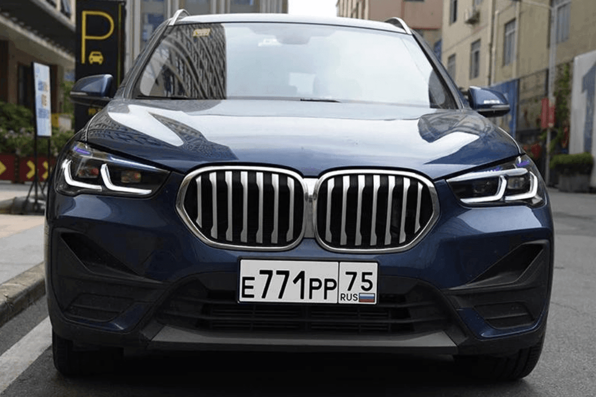 BMW F48 X1 modernized headlight upgrade by K2 Industries, showing sleek daytime running lights and clear lens design.