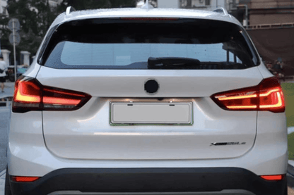 BMW F48 X1 tail light update by K2 Industries, red and smoked variants, for models 2016 to 2022, showing close-up of tail light design.