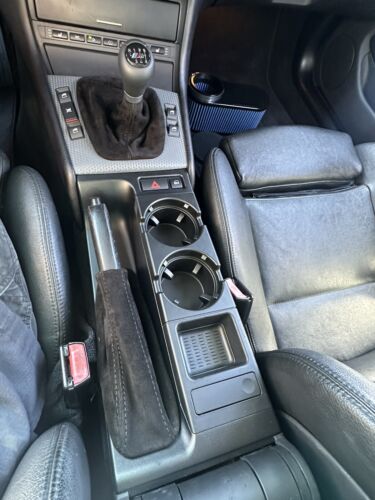 Genuine black suede BMW E36 3 Series shift and handbrake boot cover for manual transmission, by JTS Custom Upholstery.
