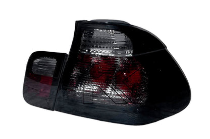Black lens tail lights for BMW Series 3 E46 sedan from 1998-2001 by K2 Industries, showing the rear view with illuminated elements.