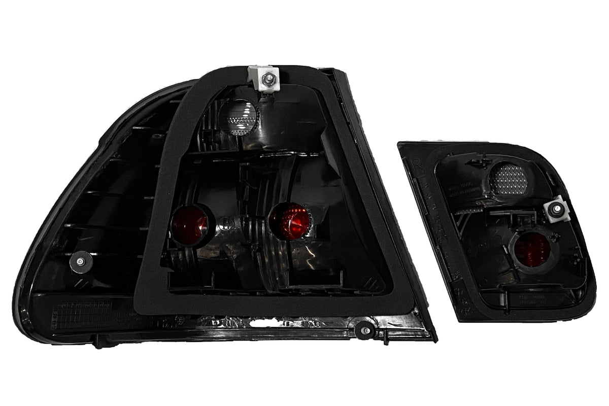 Black lens tail lights for BMW Series 3 E46 sedan (1998-2001) by K2 Industries, shown on the vehicle with clear lens details.