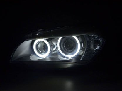 BMW X1 E84 LED Angel Eye Headlights by K2 Industries, for 2009-2012 model, featuring bright circular LED rings on a black headlight assembly.