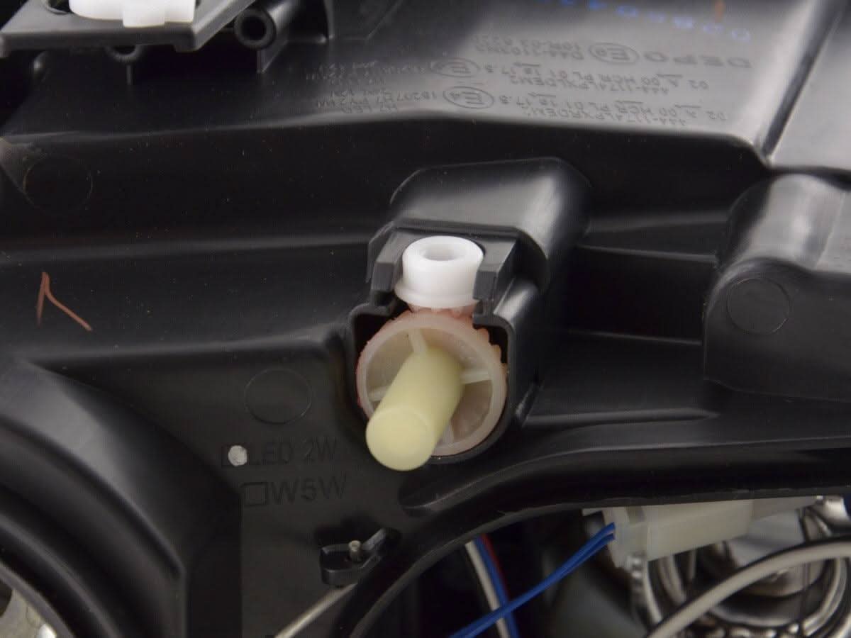 BMW X1 E84 LED Angel Eye Headlights by K2 Industries for 2009-2012, showing the headlights with bright angel eye rings.