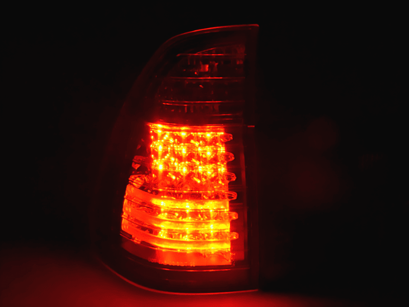 BMW X5 E53 black and clear LED tail lights from K2 Industries, for 1998-2002 model, showing the rear of the vehicle.