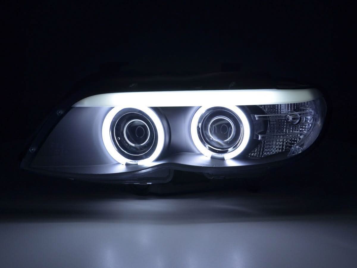 BMW X5 E53 headlights with CCFL black angel eyes and LED accents, compatible with 2003-2006 models by K2 Industries