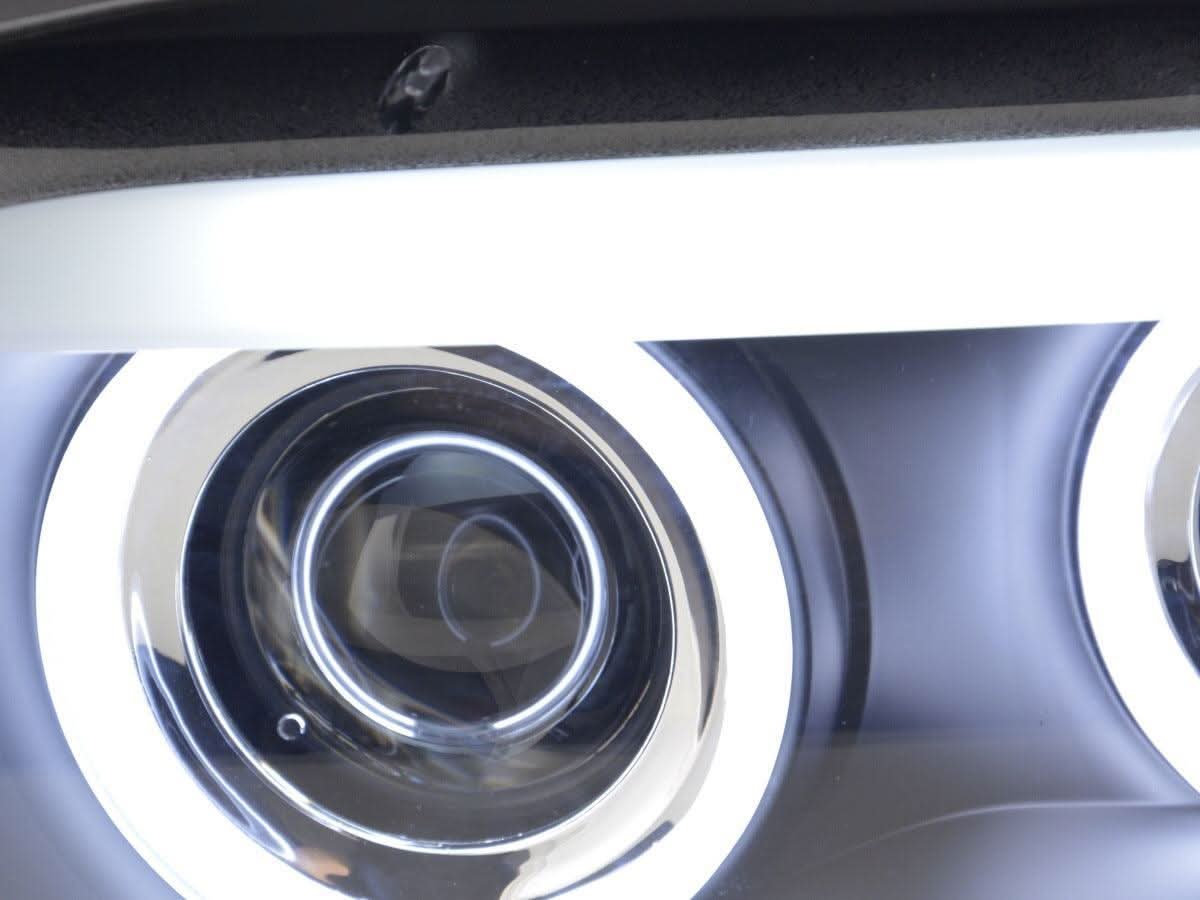 BMW X5 E53 CCFL black angel eyes LED headlights by K2 Industries, showing sleek black housing and bright LED rings for 2003-2006 models.
