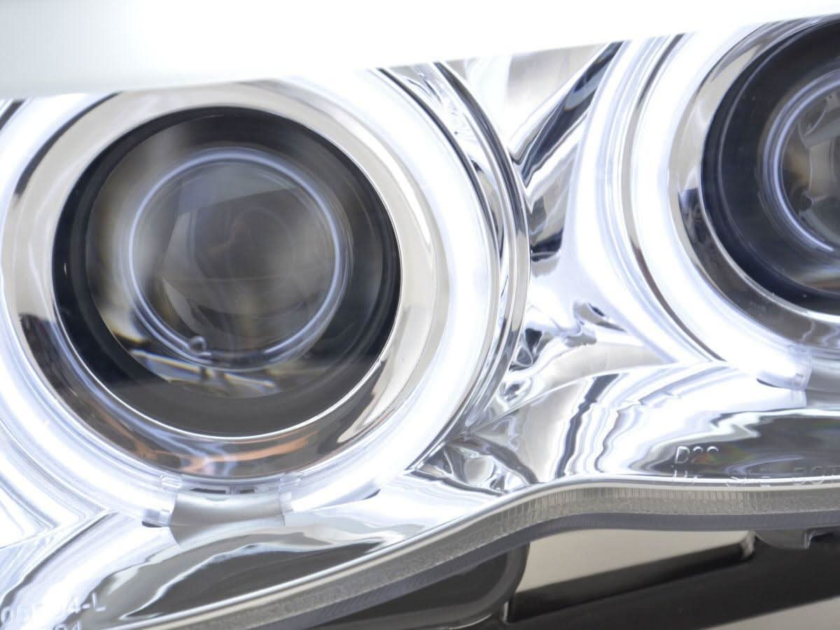 BMW X5 E53 headlights with CCFL chrome angel eyes and LED accents, designed for 2003-2006 models by K2 Industries.
