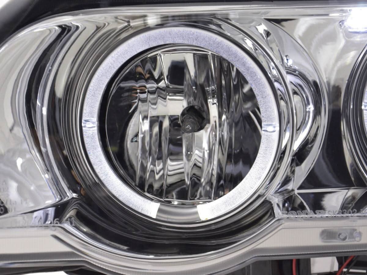 BMW X5 E53 chrome angel eyes LED headlights set by K2 Industries, featuring bright LED rings and clear headlight lenses.