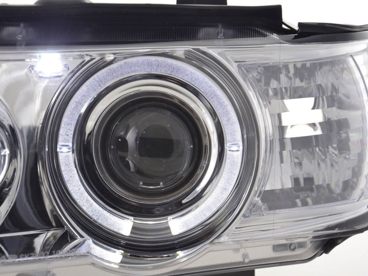 BMW X5 E53 chrome angel eyes LED headlights set by K2 Industries, showing the chrome finish and LED light elements.