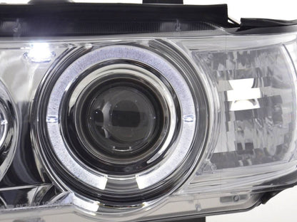 BMW X5 E53 chrome angel eyes LED headlights set by K2 Industries, showing the chrome finish and LED light elements.