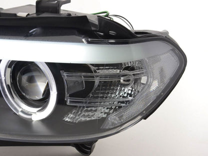 BMW X5 E53 xenon black angel eye LED headlights from K2 Industries, showing sleek design and bright illumination for 2003-2006 models.