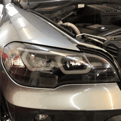 BMW X5 E70 3D Design headlights by K2 Industries for 2007-2013 model, showing sleek front view with detailed headlight design.