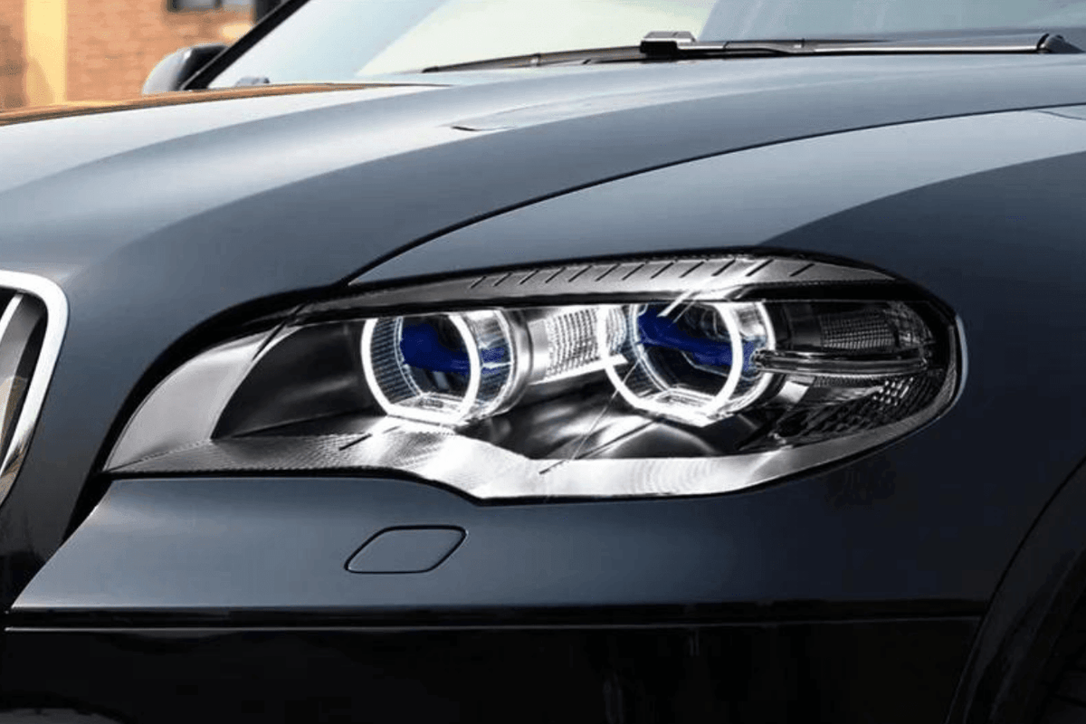 BMW X5 E70 headlight with OE style angel eyes and projector, designed for 2007-2013 models by K2 Industries.