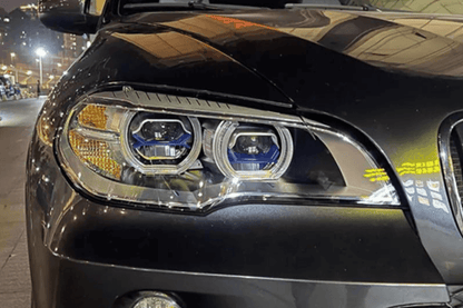 BMW X5 E70 OE Style Angel Eyes projector headlight by K2 Industries, showing the sleek design with angel eye rings and projector lens.