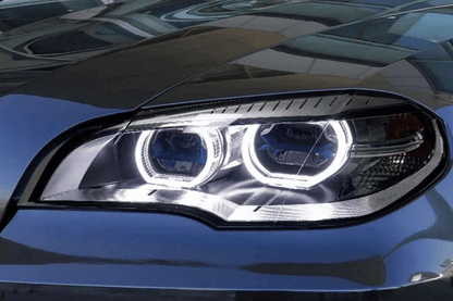 BMW X5 E70 projector headlights with OE style angel eyes from K2 Industries, showcasing sleek design for models 2007-2013.