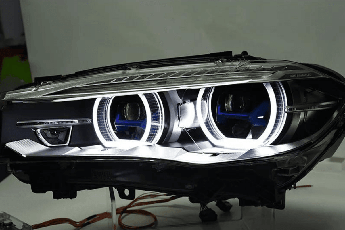 BMW X5 F15 F16 headlights with laser-style blue accents, upgrade by K2 Industries for models 2012-2019, close-up view