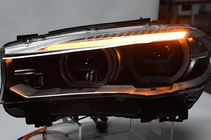 BMW X5 F15 F16 headlights with blue laser style accents, upgrade by K2 Industries for 2012-2019 models, showing detailed headlight design.