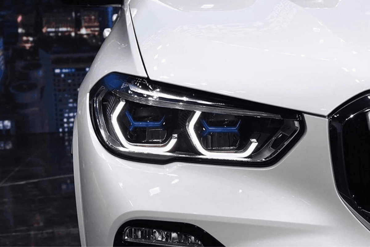 BMW X5 G05 modernized projector headlights with blue accents, upgrade by K2 Industries for 2019-2024 models, featuring sleek headlight design.