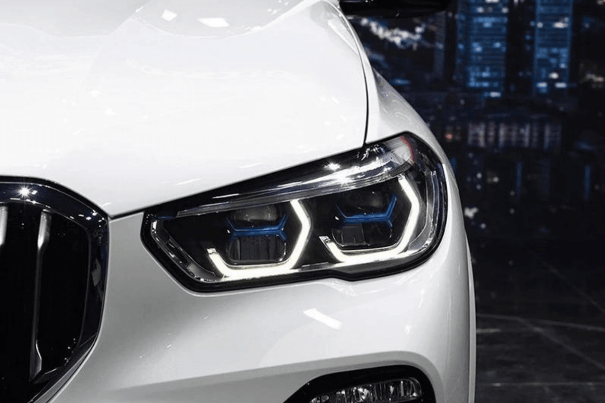 BMW X5 G05 projector headlights upgrade with blue accents by K2 Industries, showcasing modernized design for 2019-2024 models.