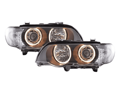 BMW X5 E53 black OE+ Angel Eyes headlights by K2 Industries, showing the sleek headlight design with angel eye rings for 2000-2003 models.