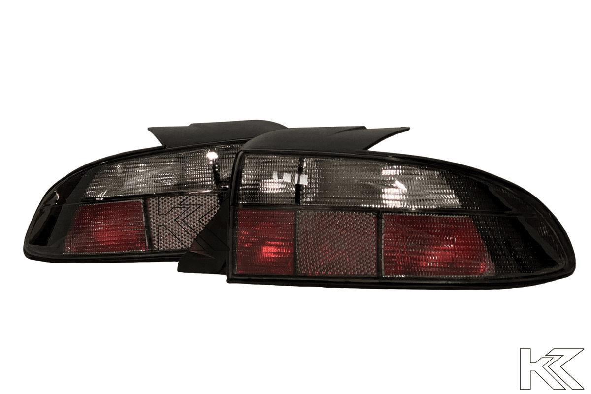 BMW Z3 OEM style smoked tail lights by K2 Industries, showcasing sleek, smoked lens design for 1990-1999 BMW Z3 rear lighting.